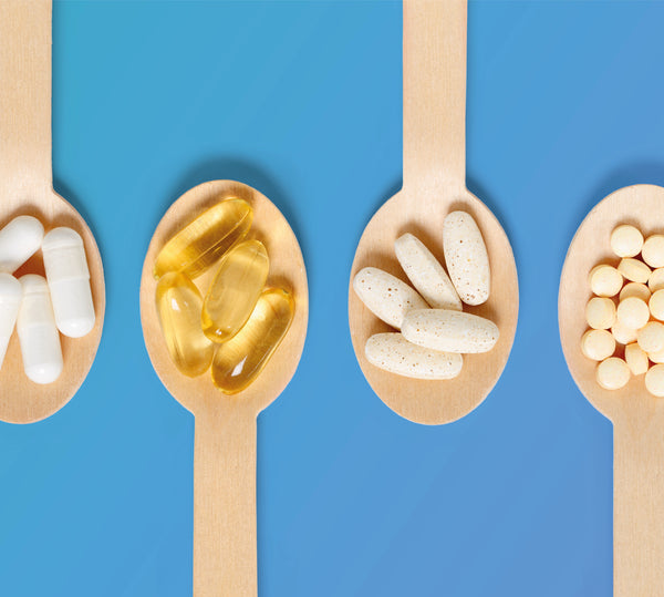 Selection of different supplements sitting on spoons